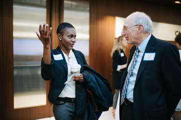 a female student speaking with her mentor in the atrium