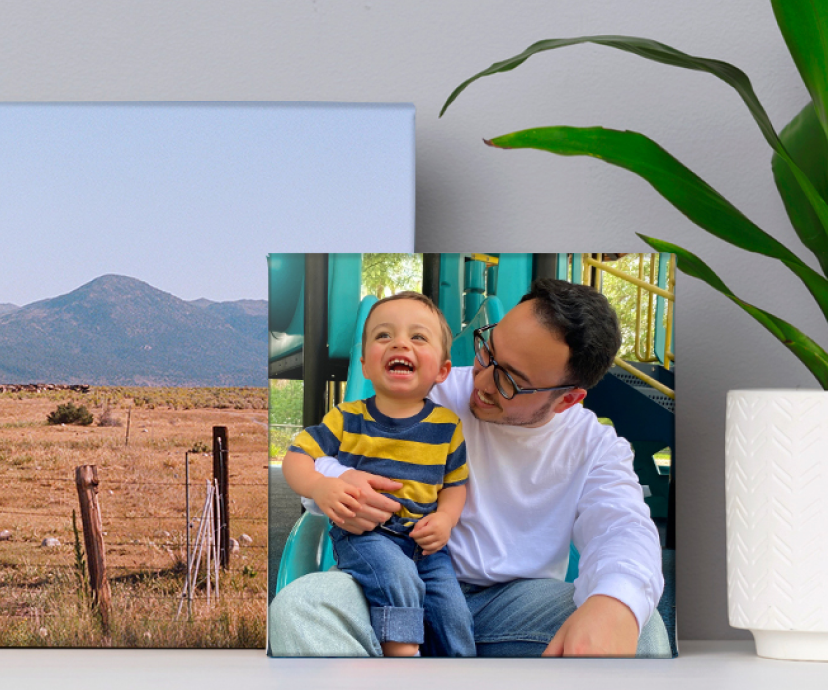 A photo canvas print featuring a father and son embracing and laughing.