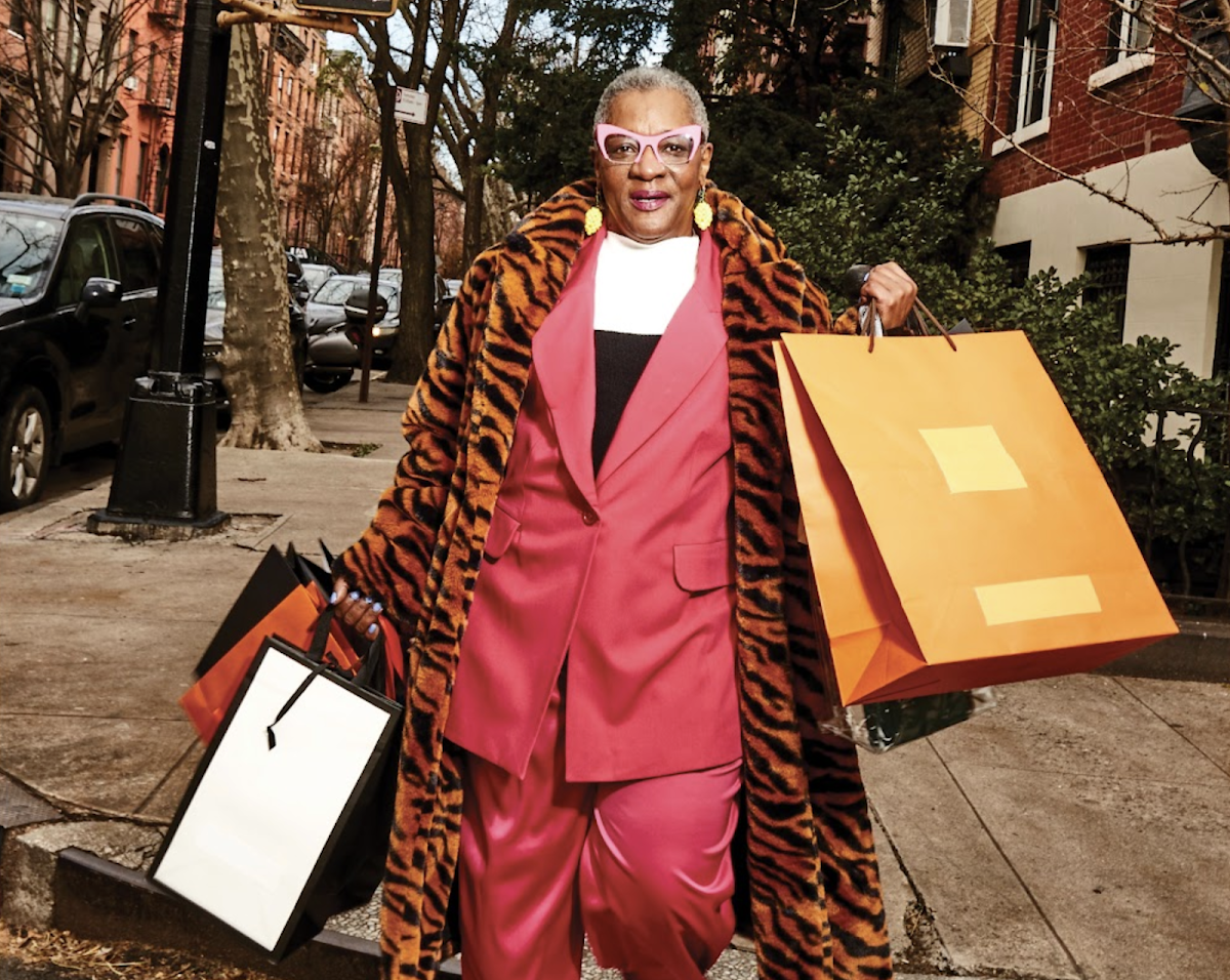 person holding many shopping bags