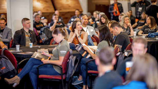 Attendees of the Bunker Labs 2019 National Summit sitting together in a conference room