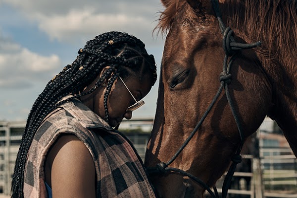 Keiara standing face to face in an intimate moment with her horse Penny.