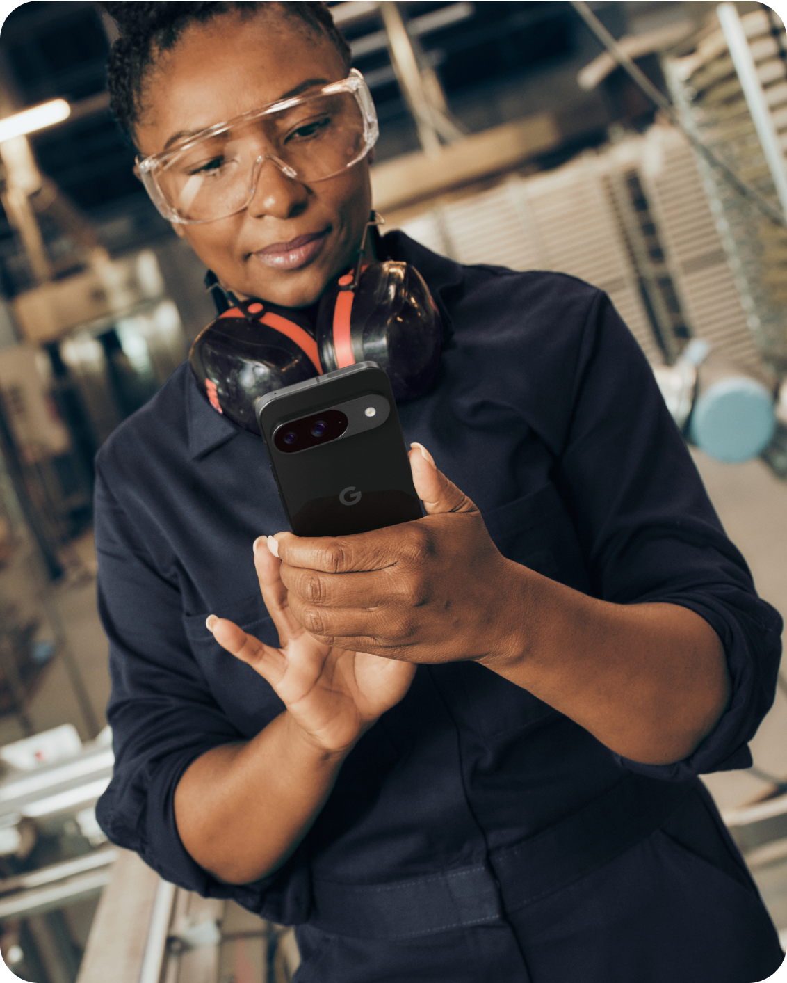 A woman working on her Google Pixel 9 phone.