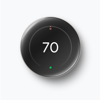 A stainless steel Nest Learning Thermostat against a white background.