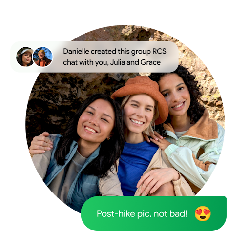 A selfie of a group of people posing after a hike with a transparent white box at the upper left corner that reads "Danielle created this group RCS chat with you. Julia and Grace" and another green text bubble overlays the picture at the bottom right corner that reads "Post-hike pic, not bad!" next to a heart-eyes emoji.