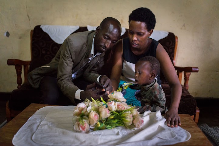 Portrait of Clementine with her husband and young son.