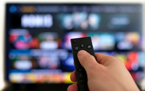 A person streaming through a TV.