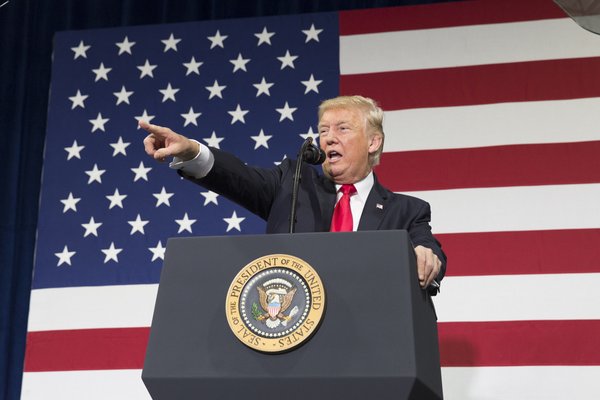 President Trump passionately addressing a crowd.