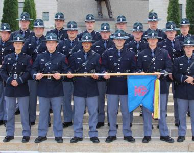 State patrol graduates in ceremonial uniforms