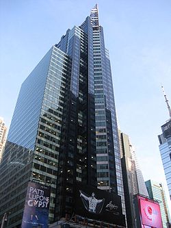 The glass facade of the building as seen from Broadway. On the right is the building's prow, which protrudes from the facade.