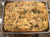 A homemade rosemary focaccia baked in the United States