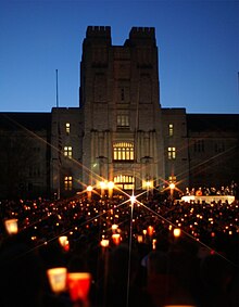 A crowd of people holding candles.