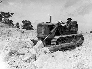 A No. 5 Airfield Construction Squadron bulldozer working in a coral quarry at Noemfoor Island during December 1944