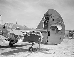 Damaged tail assembly of a single-engined fighter plane