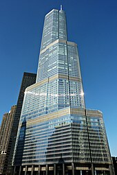 the Trump International Hotel and Tower, a tall steel Chicago skyscraper with aquamarine windows, as seen on a sunny day