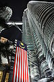 Looking up from the base at night with a Malaysian flag banner