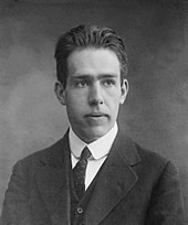 Head and shoulders of young man in a suit and tie