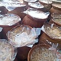 Sweet yoghurt, made and contained in pots of clay are kept for sale, Bangladesh.