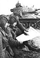 Image 38Soldiers in an East German tank unit reading about the erection of the Berlin Wall in 1961 in Neues Deutschland (from Newspaper)