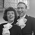 Black-and-white photograph of Pearl Carr and Teddy Johnson during a performance.