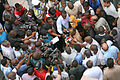 Image 7Photo and broadcast journalists interviewing government official after a building collapse (from Broadcast journalism)