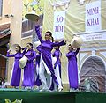 The female students wearing purple Áo dài are dancing, January 2009