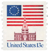 1975 13� stamp features the Betsy Ross flag behind Independence Hall[77]