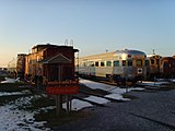 Could that be a Budd SPV-2000 behind that rusty red caboose in Strasburg, Pennsylvania?