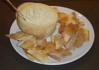 Torta del Casar served with biscuits