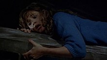 A still of Dana Kimmell acting and performing the barn beam stunt in Friday the 13th Part III (1982)