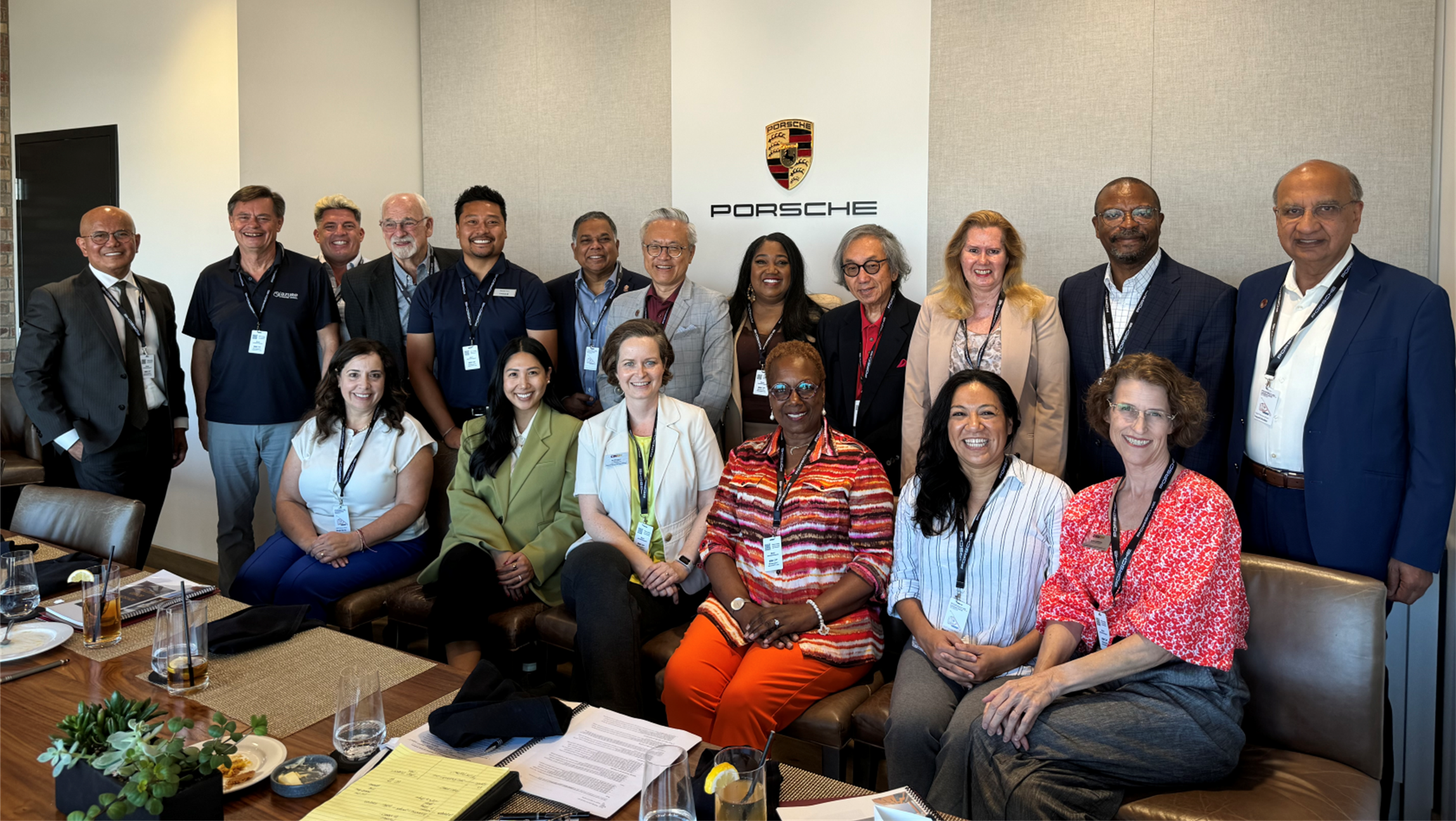 board members standing and sitting together