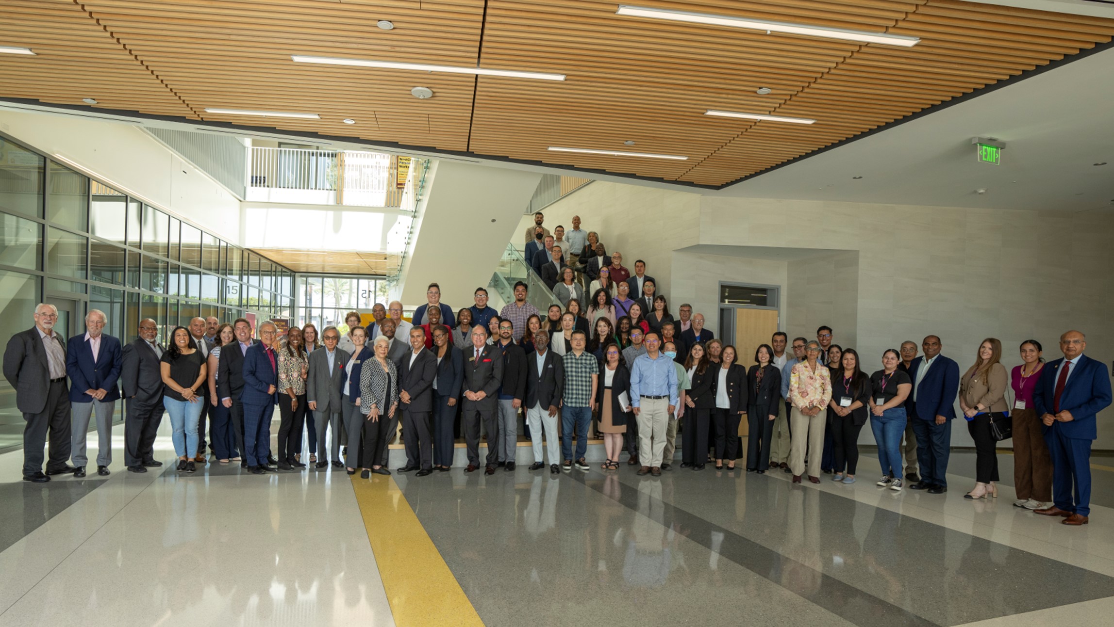 Faculty and Staff standing next to each other