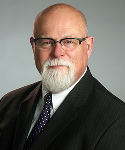 Comm. Eric B. Watness (Ret.)