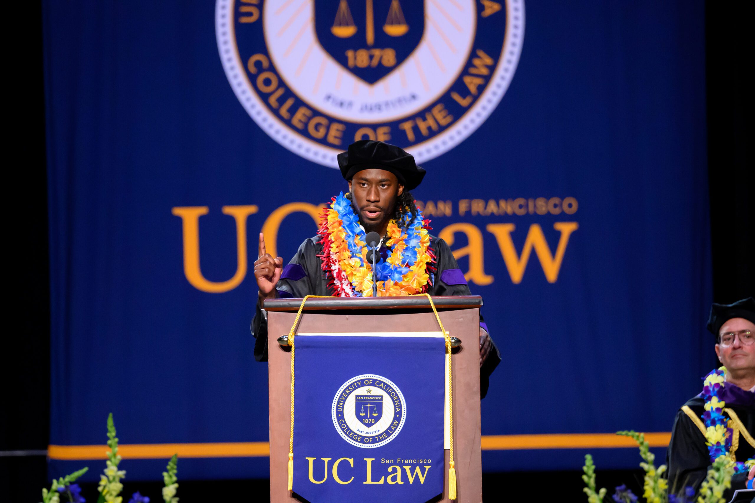 student speaking at commencement