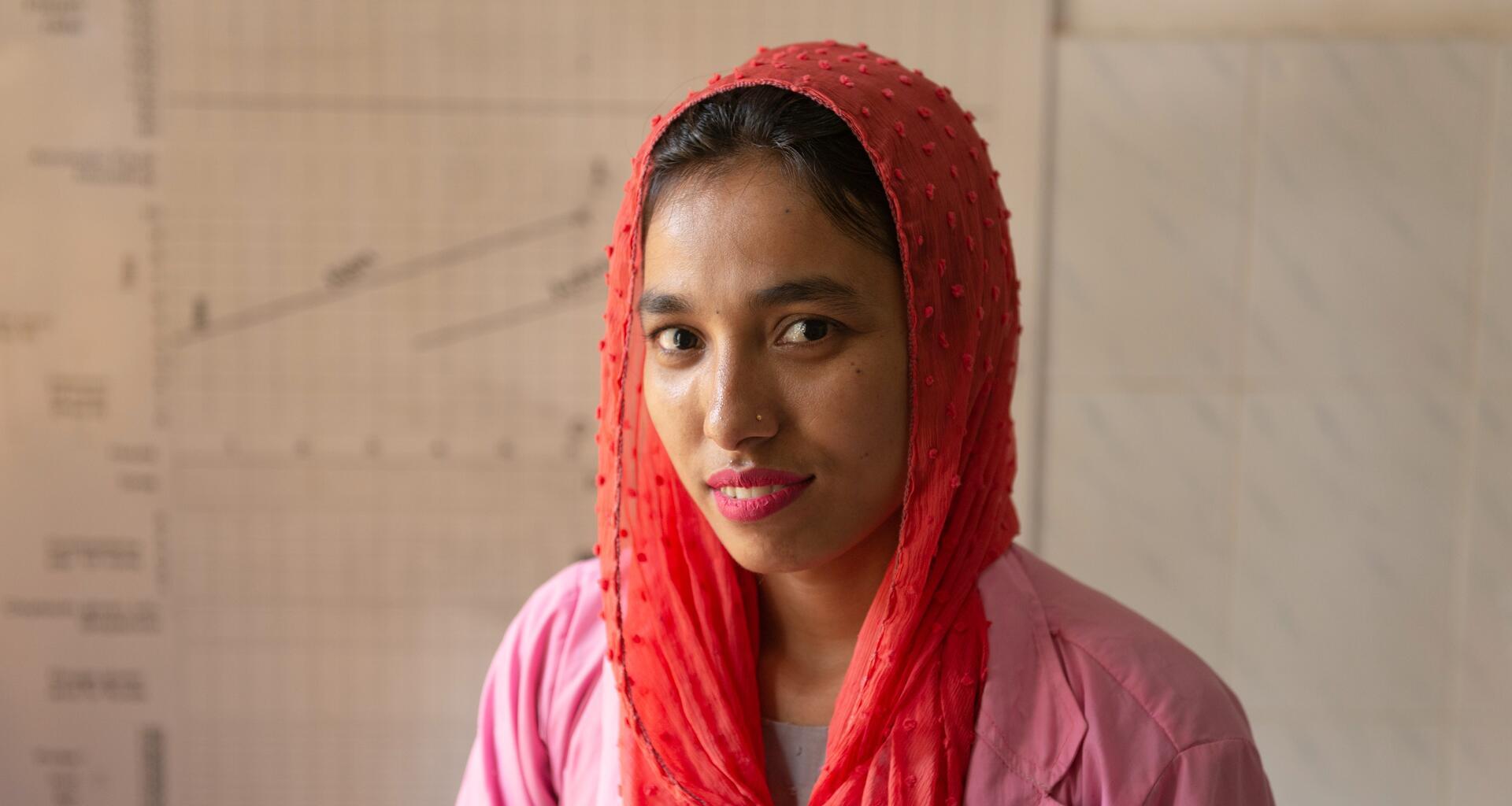 A young woman smiles.