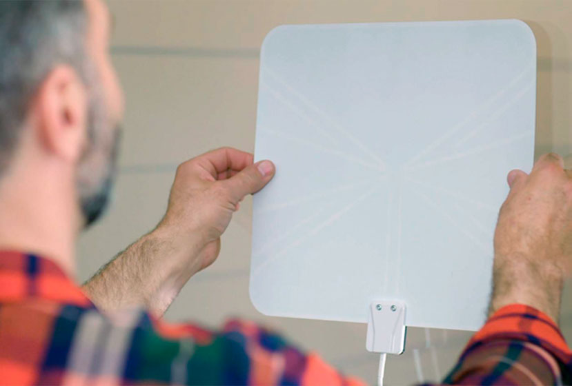 Man installing antenna