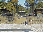 Several traditional buildings including a gate.