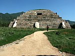 Ruins of a low step-pyramid like structure.