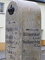 Stein mit Angaben in Kilometern