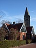 Voormalige Hervormde pastorie. Huizencomplex voorzien van zadeldaken tussen houten gevels met uitgeschulpte windveren