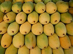 Ripe mangoes being sold in a market in the Philippines