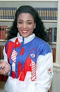 Florence Griffith-Joyner – über 100 Meter mit der ersten von drei Goldmedaillen