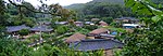 Overview of a village with traditional houses.