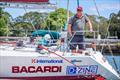 Brett Avery smiling on the transom ahead of the 2022 Rolex Sydney Hobart Yacht Race 